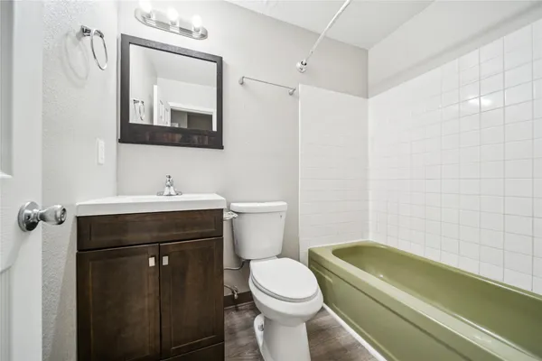 a bathroom with a sink a toilet and a bathtub