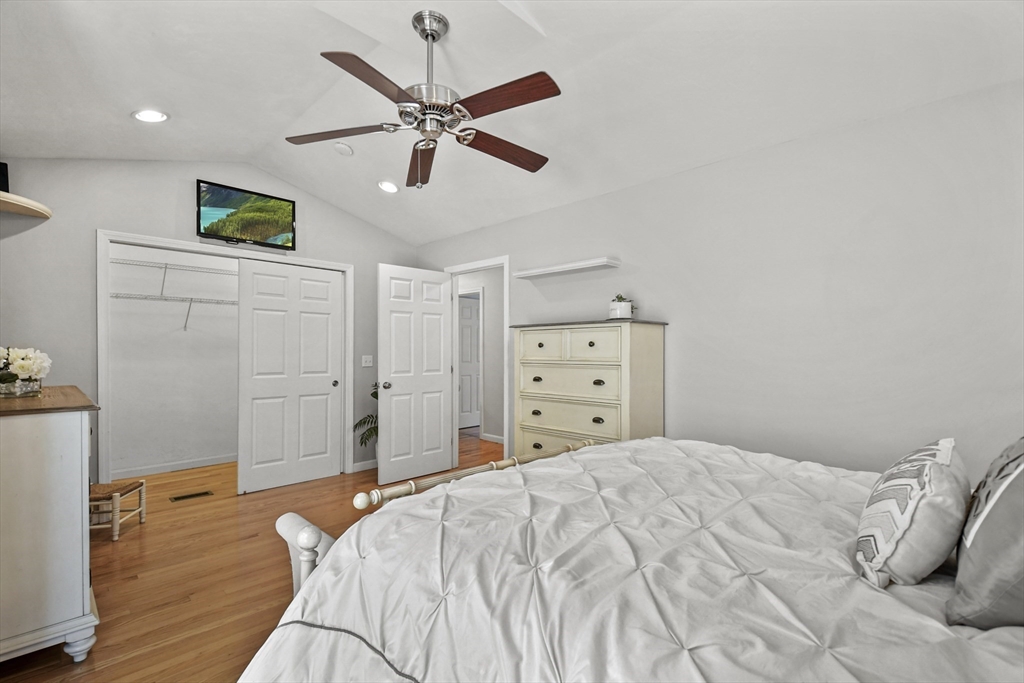 7 St Marks Road Worcester, MA 01606 - Photo 14 of 36 a bedroom with a bed and a chandelier