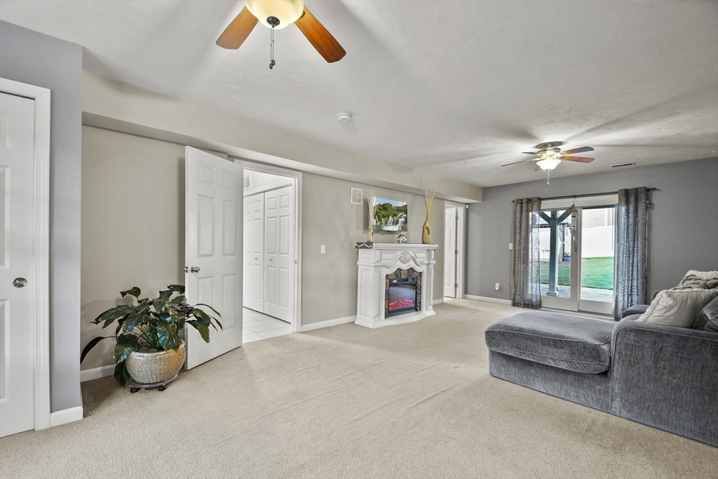 7 St Marks Road Worcester, MA 01606 - Photo 20 of 36 a spacious bedroom with a bed and a couch