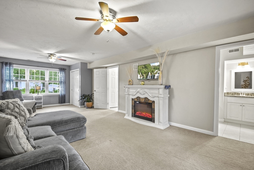 7 St Marks Road Worcester, MA 01606 - Photo 22 of 36 a living room with furniture and a fireplace