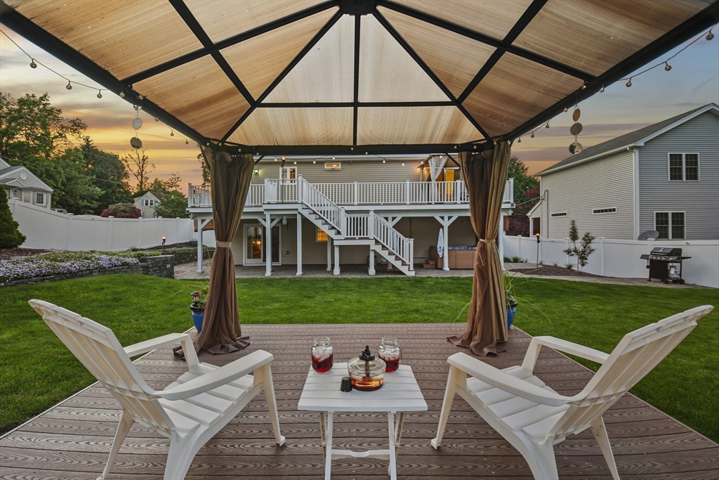 7 St Marks Road Worcester, MA 01606 - Photo 36 of 36 a view of a patio with table and chairs potted plants and a palm tree