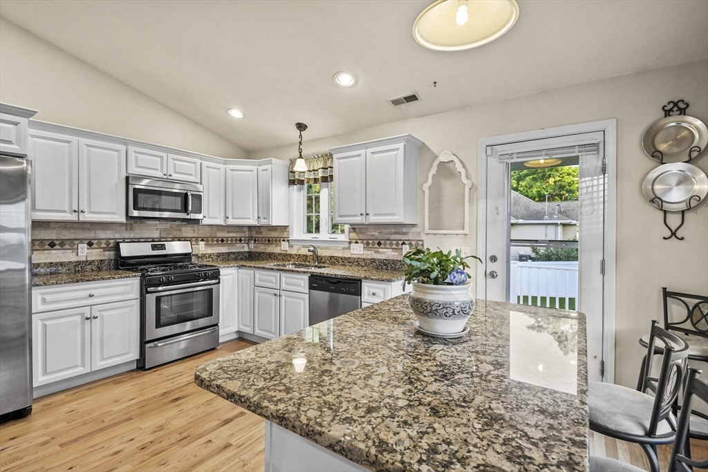 7 St Marks Road Worcester, MA 01606 - Photo 10 of 36 a kitchen with a sink stove and microwave