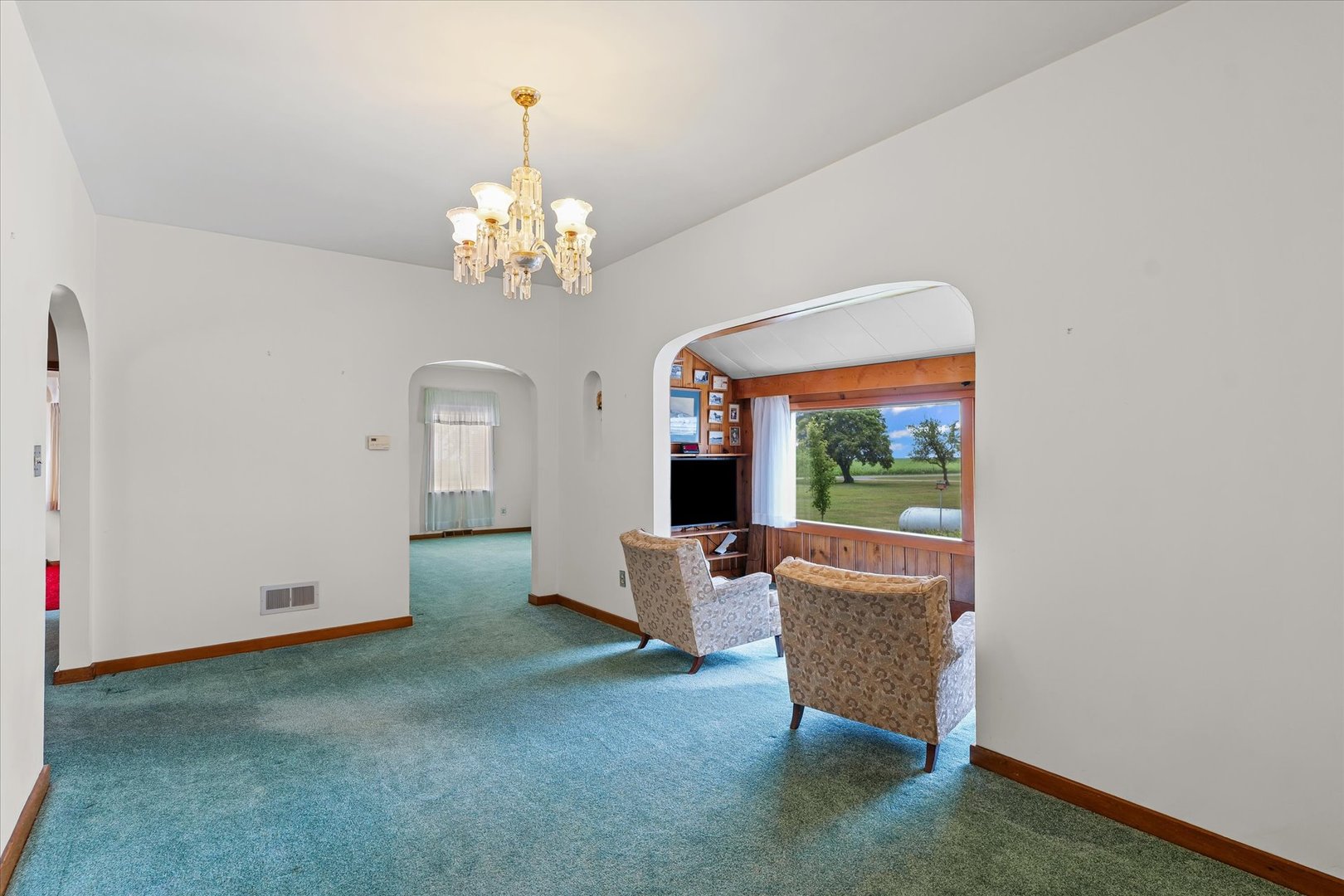 6292 North 100 East Road Allerton, IL 61810 - Photo 13 of 61 a living room with furniture and a chandelier