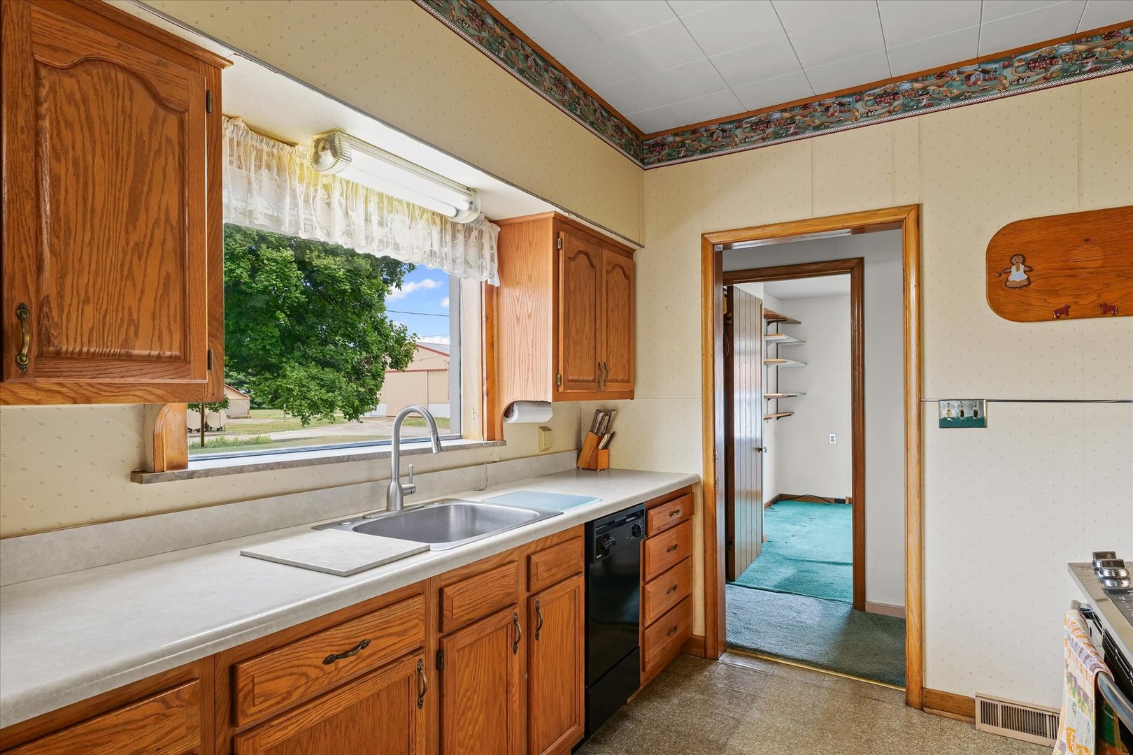 6292 North 100 East Road Allerton, IL 61810 - Photo 18 of 61 a kitchen with a sink and a window