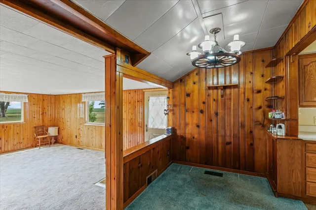 a view of room with window and ceiling fan