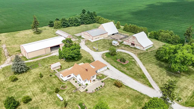 an aerial view of a house with outdoor space