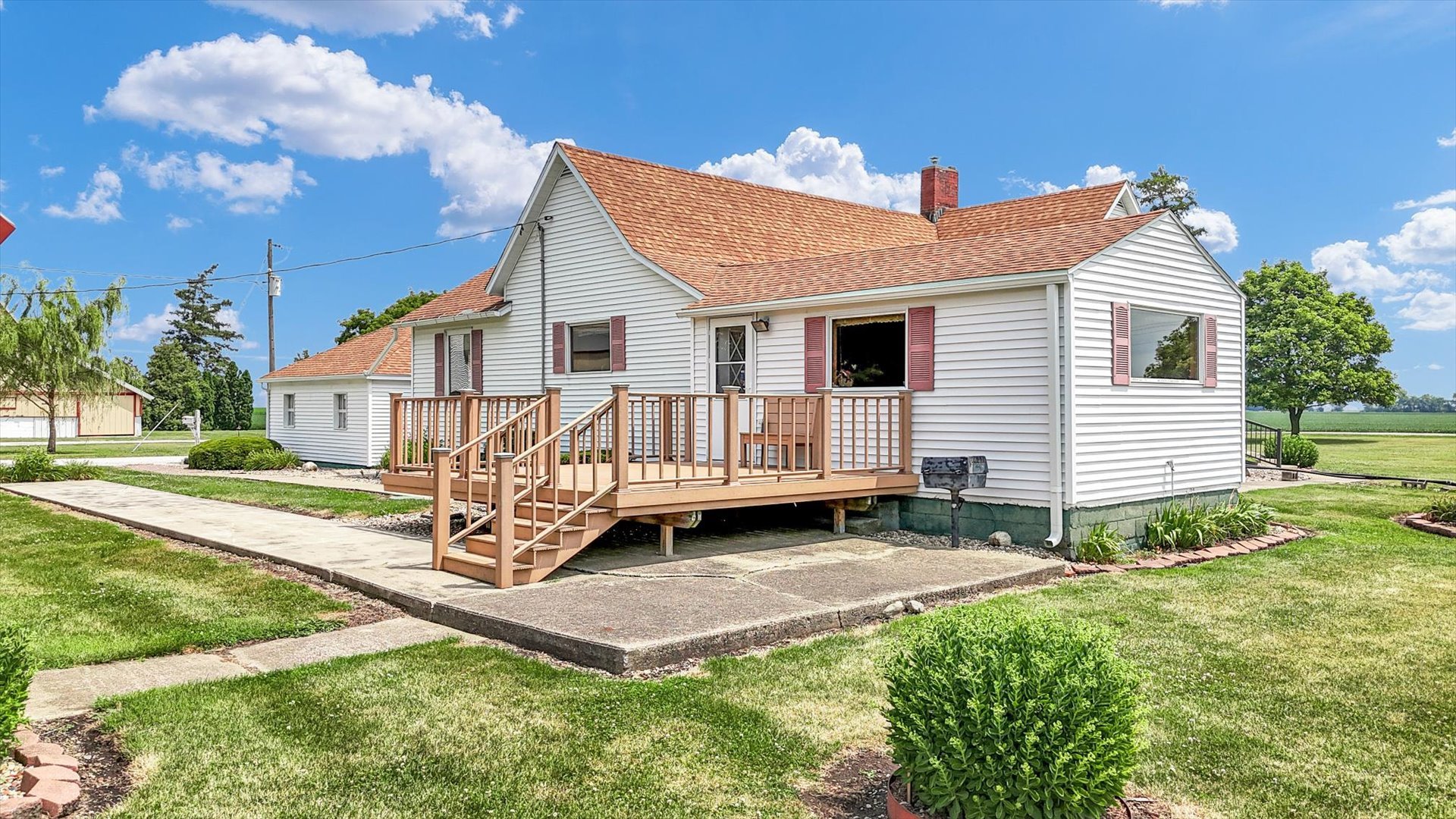 6292 North 100 East Road Allerton, IL 61810 - Photo 37 of 61 a white house that has a small yard and couches chairs with wooden fence