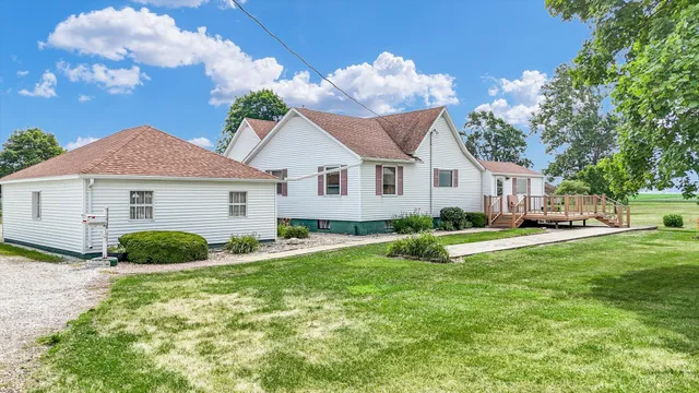 a view of an entryway with a table and chairs