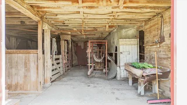 a view of a backyard with wooden fence