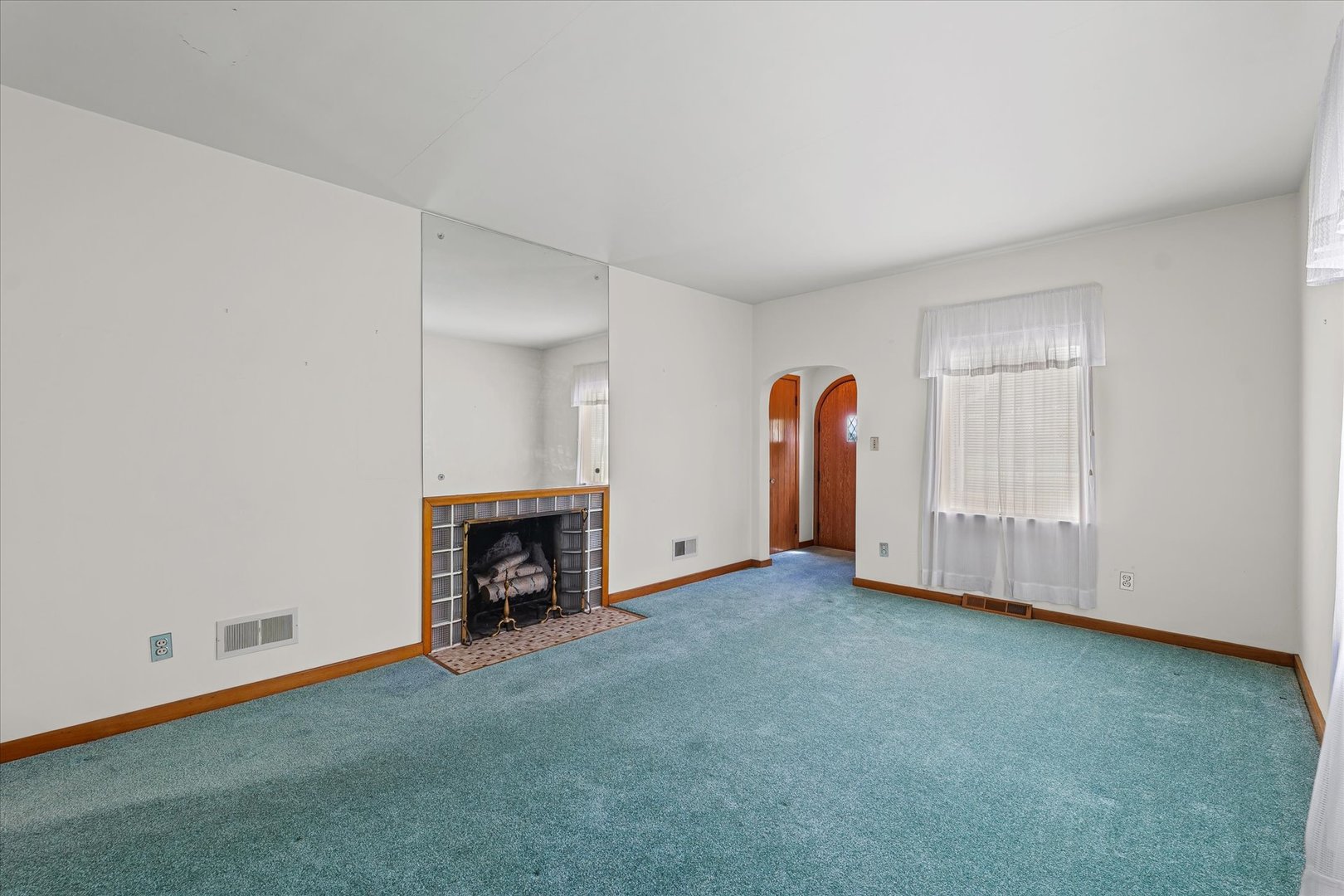 6292 North 100 East Road Allerton, IL 61810 - Photo 10 of 61 an empty room with fireplace and window