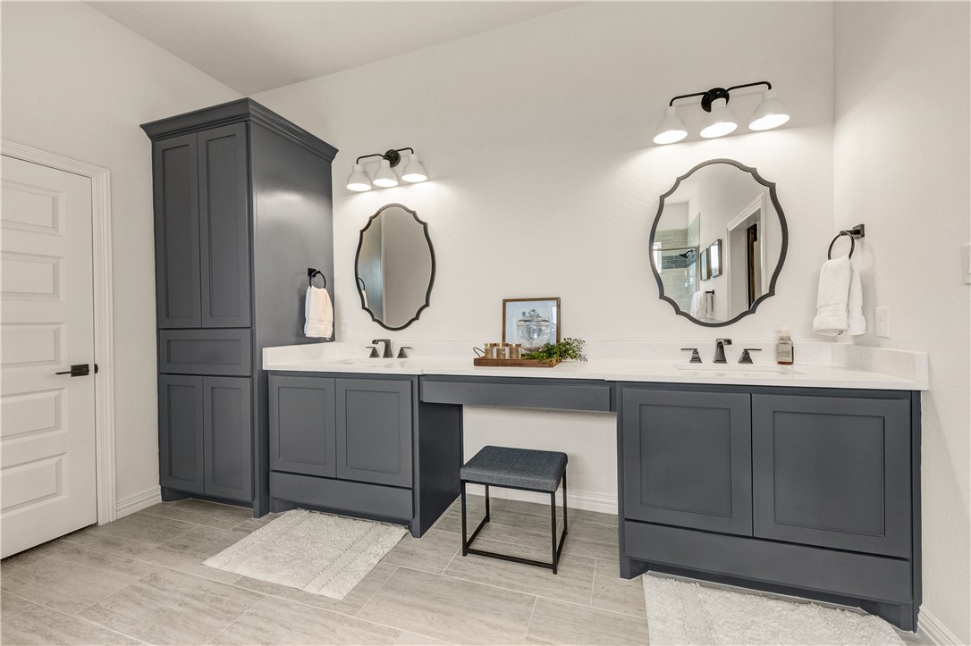 1624 Bennett Street Bryan, TX 77802 - Photo 16 of 22 a bathroom with a sink and a mirror