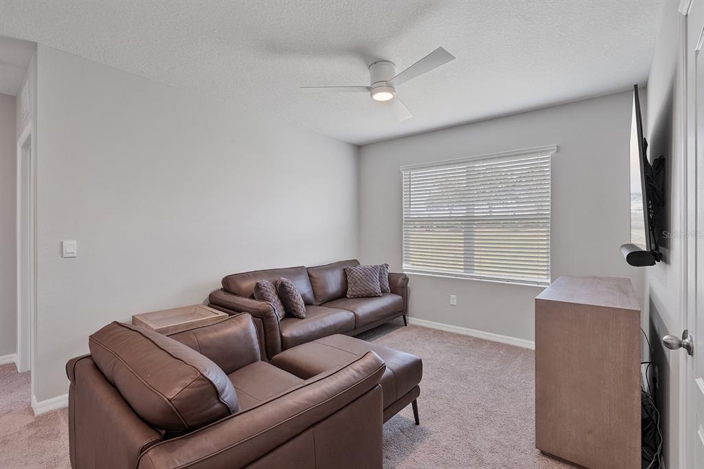 1328 Calmito Lane Mount Dora, FL 32757 - Photo 14 of 29 a living room with furniture and a window