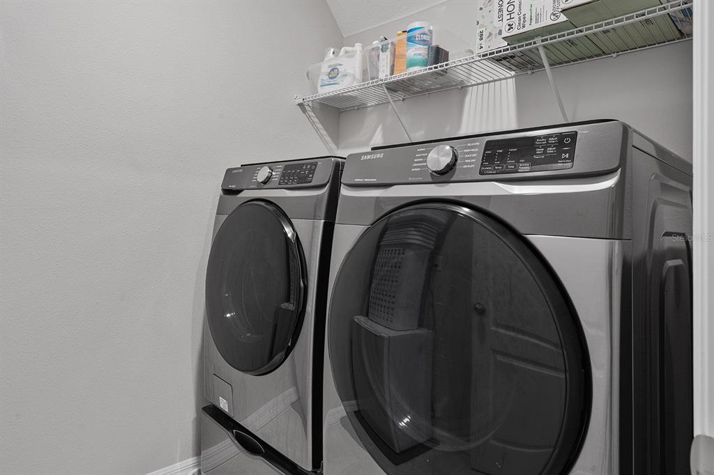 1328 Calmito Lane Mount Dora, FL 32757 - Photo 26 of 29 a utility room with dryer and washer
