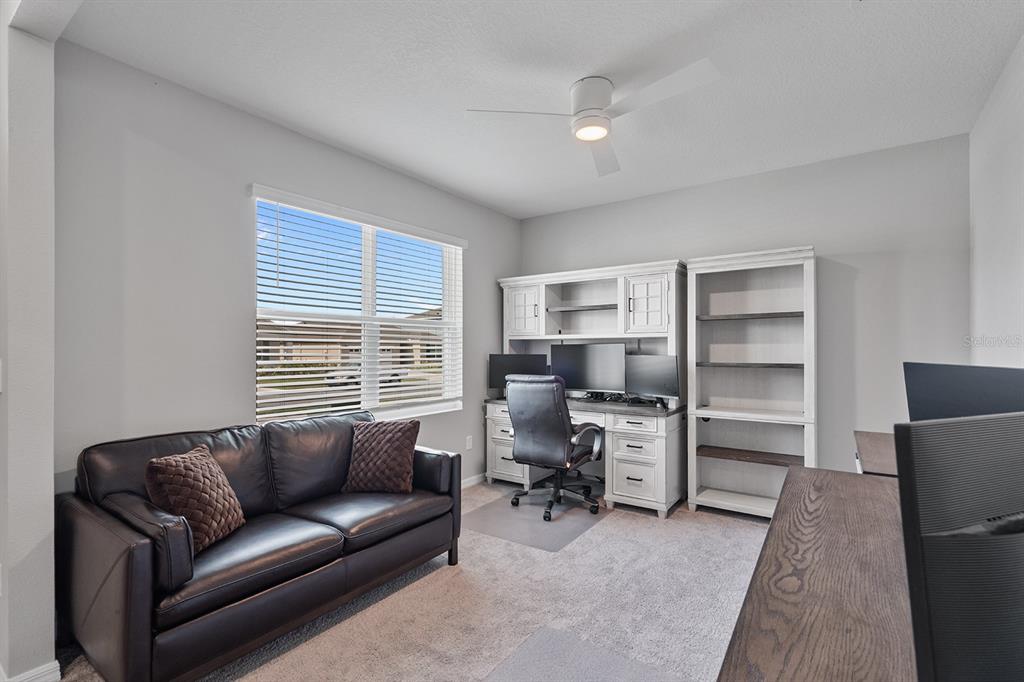 1328 Calmito Lane Mount Dora, FL 32757 - Photo 3 of 29 a living room with furniture and a window
