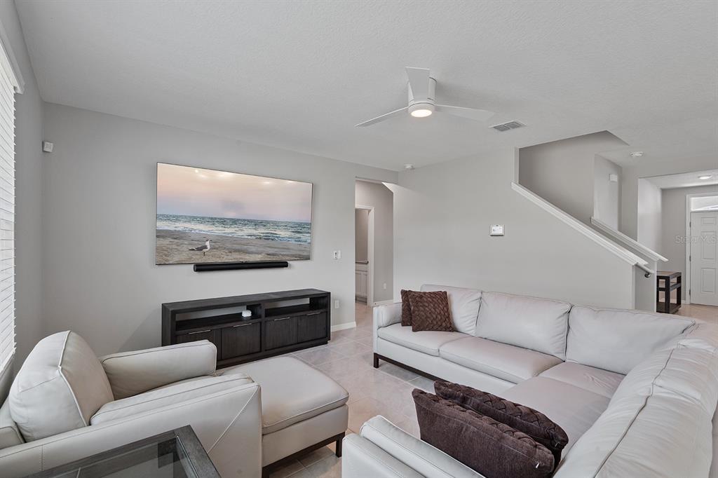 1328 Calmito Lane Mount Dora, FL 32757 - Photo 7 of 29 a living room with furniture and a flat screen tv