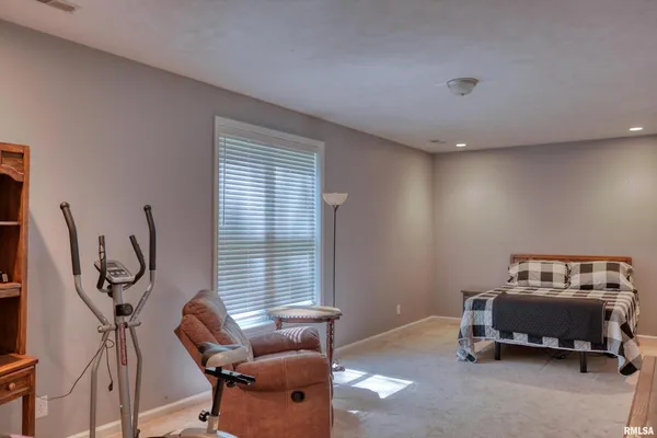 a view of a chair and table on the wooden deck