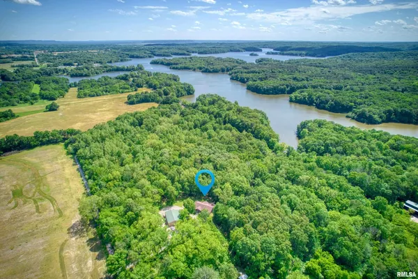 a front view of a house with a yard and porch