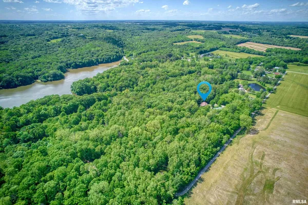 a front view of a house with a yard table and chairs