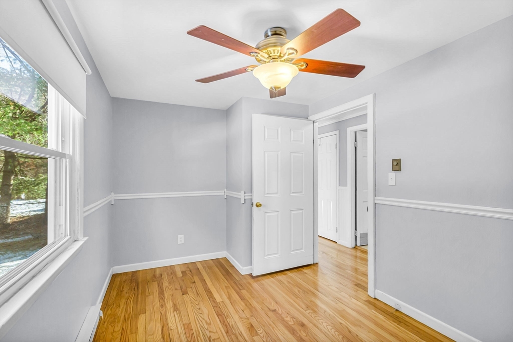 232 Spikenard Circle Springfield, MA 01129 - Photo 14 of 42 wooden floor in an empty room with a window