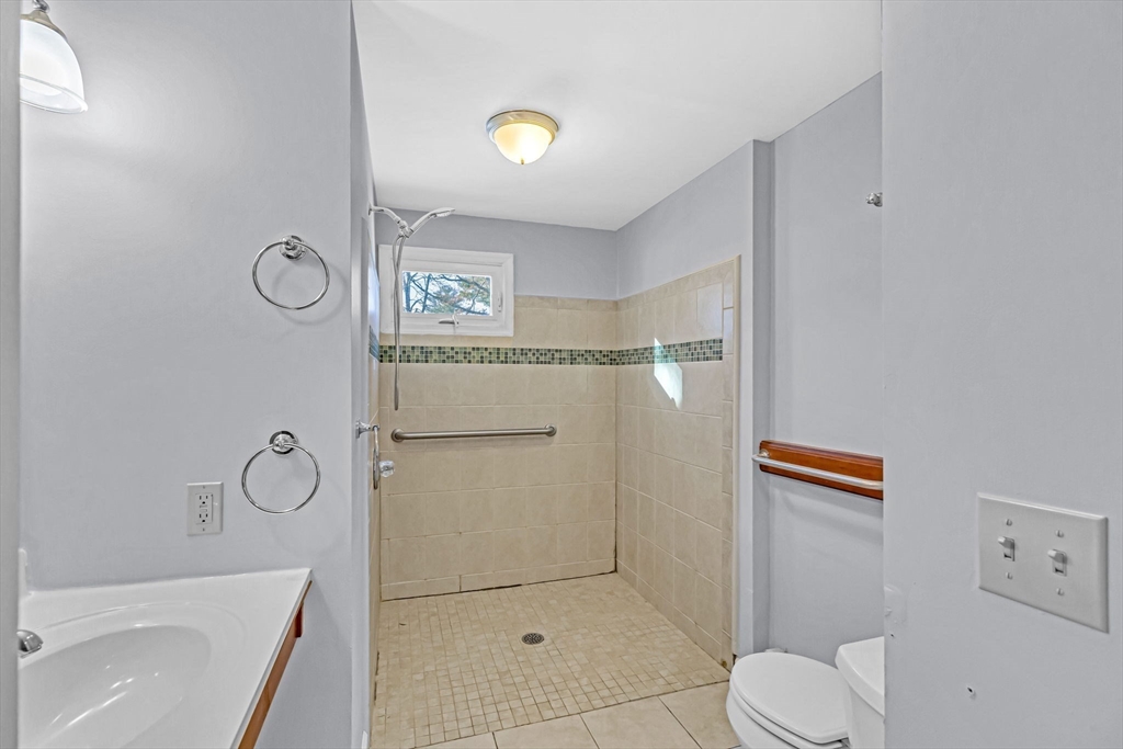 232 Spikenard Circle Springfield, MA 01129 - Photo 15 of 42 a bathroom with a shower a toilet and a sink