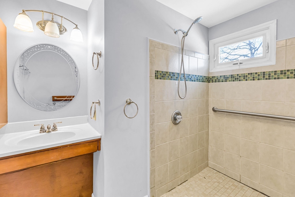 232 Spikenard Circle Springfield, MA 01129 - Photo 17 of 42 a bathroom with a sink and a mirror