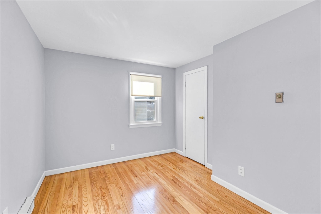 232 Spikenard Circle Springfield, MA 01129 - Photo 18 of 42 a view of empty room with wooden floor