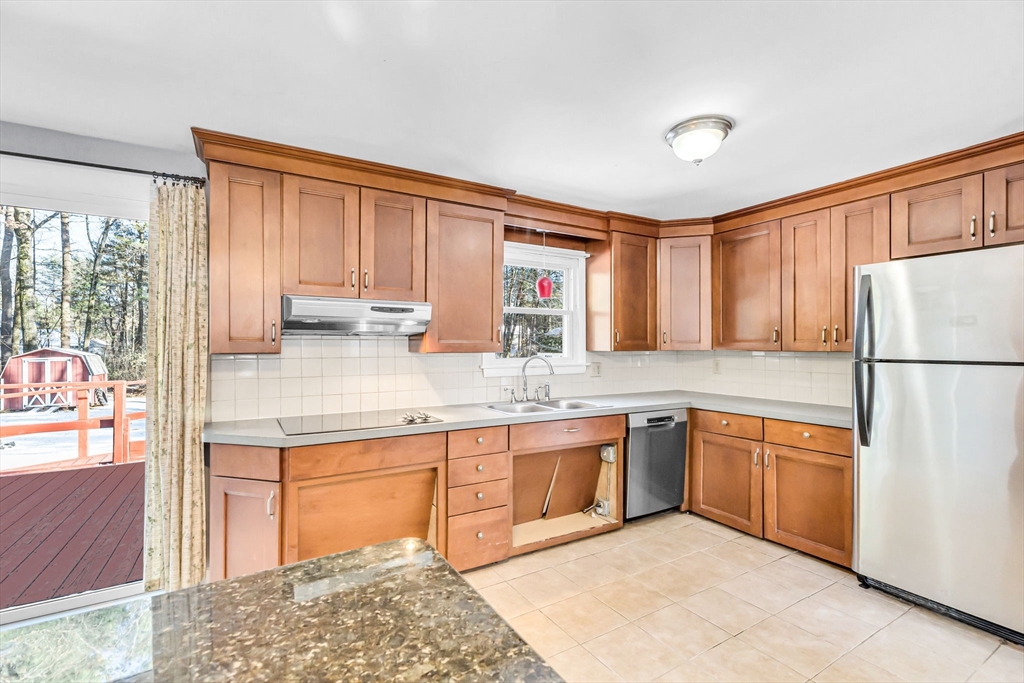 232 Spikenard Circle Springfield, MA 01129 - Photo 2 of 42 a kitchen with stainless steel appliances granite countertop a refrigerator sink and cabinets