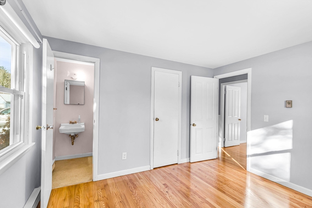 232 Spikenard Circle Springfield, MA 01129 - Photo 21 of 42 a bedroom with a bed and a view of bathroom