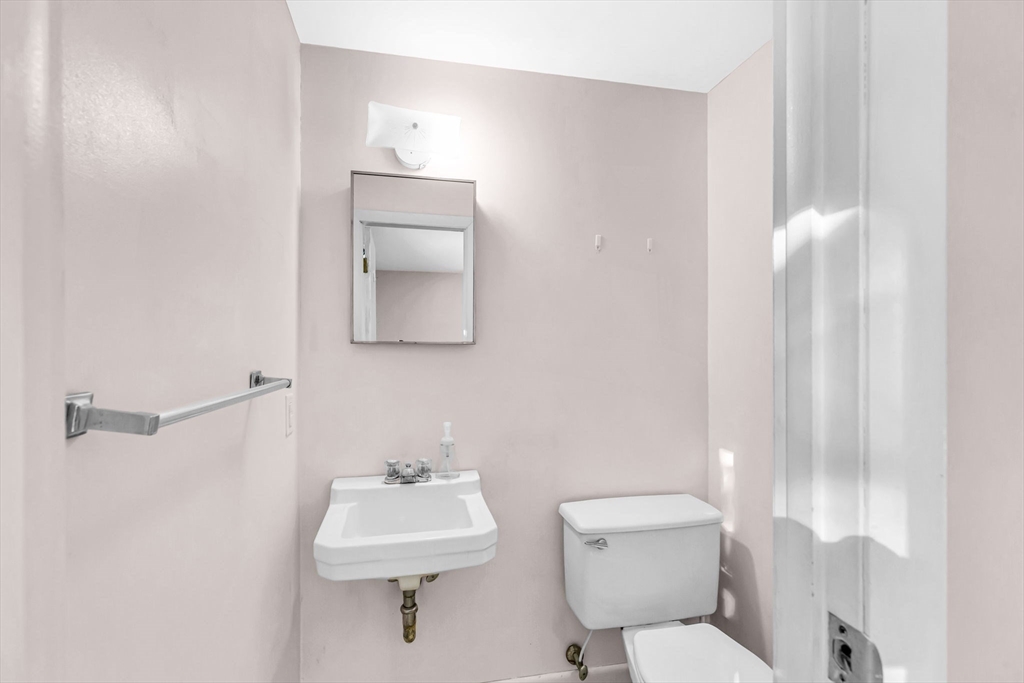 232 Spikenard Circle Springfield, MA 01129 - Photo 22 of 42 a bathroom with a sink a toilet and a mirror