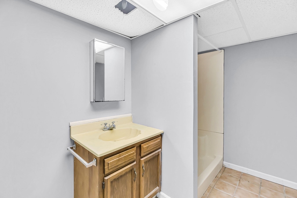 232 Spikenard Circle Springfield, MA 01129 - Photo 29 of 42 a bathroom with a sink and a mirror