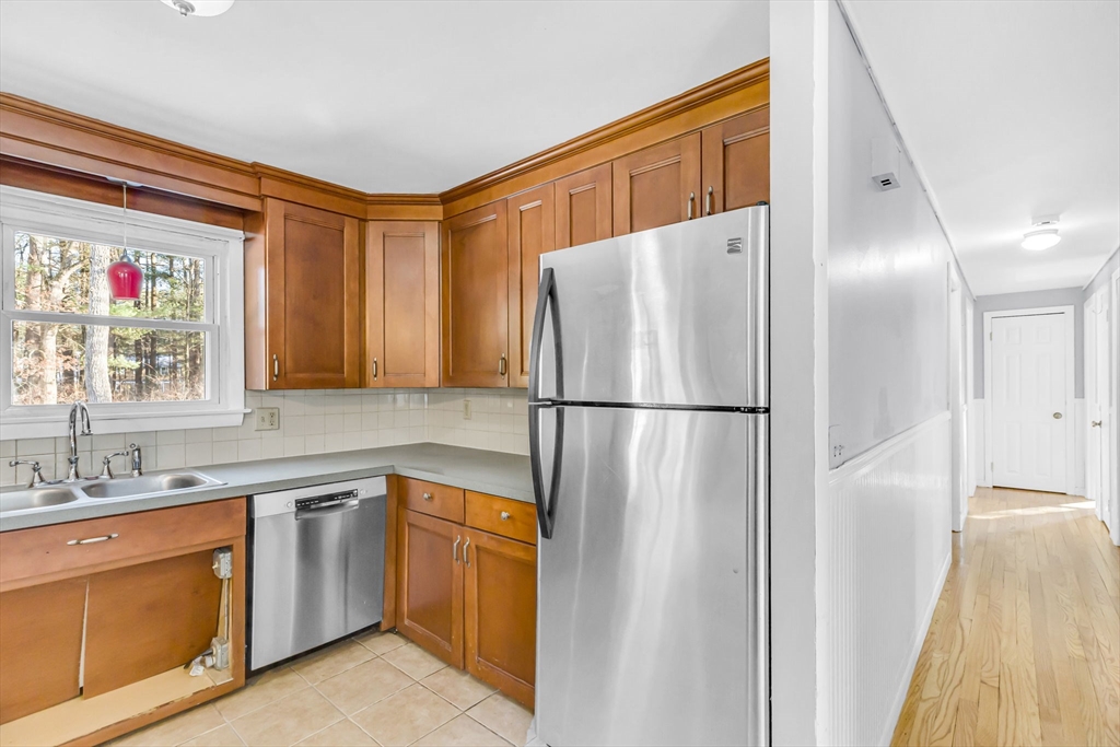 232 Spikenard Circle Springfield, MA 01129 - Photo 3 of 42 a kitchen with a refrigerator and a sink