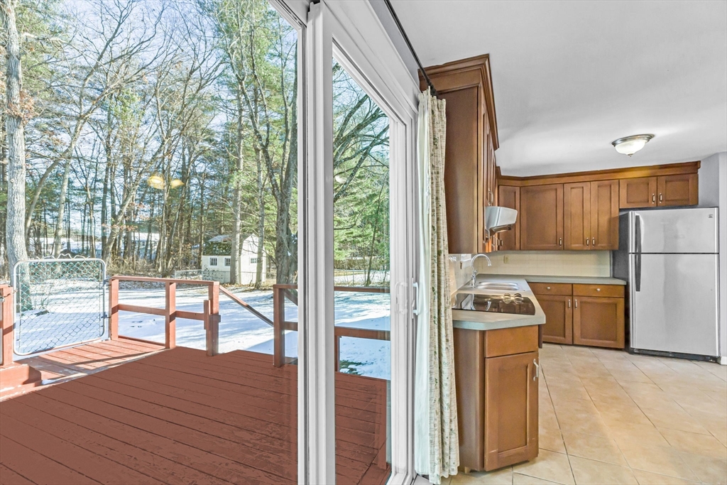 232 Spikenard Circle Springfield, MA 01129 - Photo 7 of 42 a kitchen with a refrigerator a stove and wooden floor