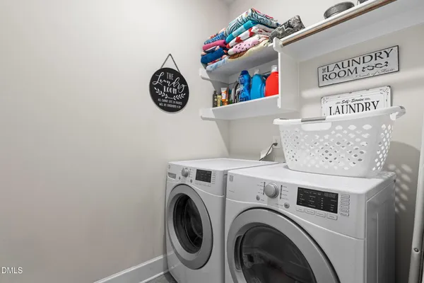 a room with pool table and windows