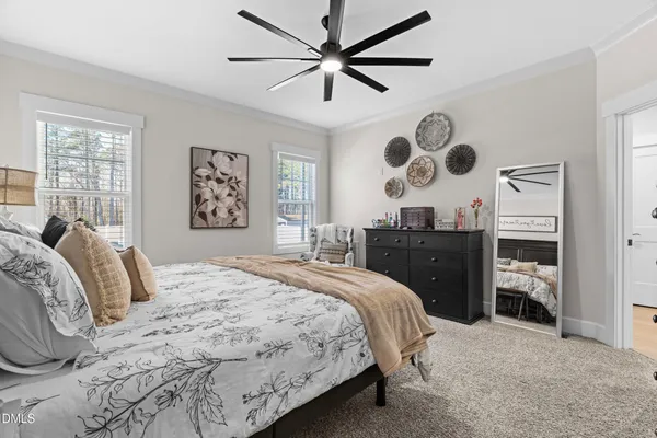a bathroom with a granite countertop double vanity sink and a mirror