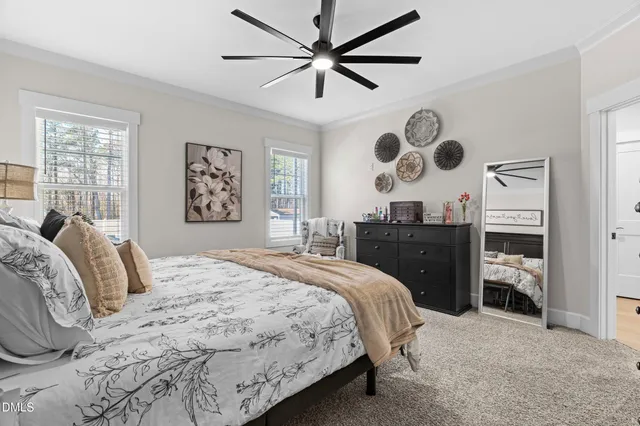 a bathroom with a granite countertop double vanity sink and a mirror