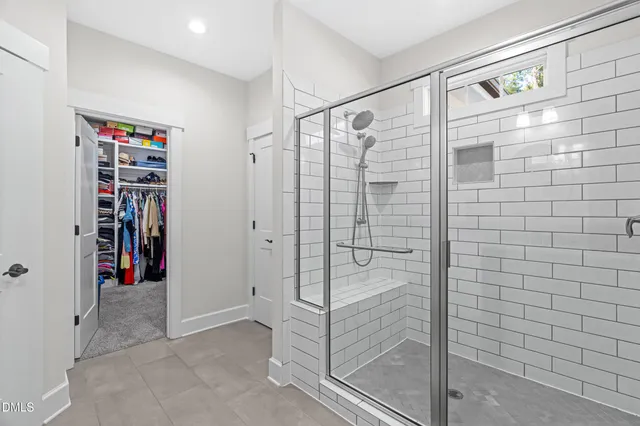 a bathroom with a shower a toilet and a sink