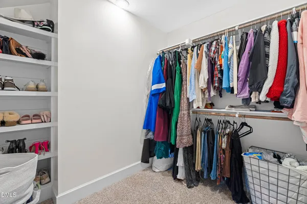 a reading room with furniture and a flat screen tv