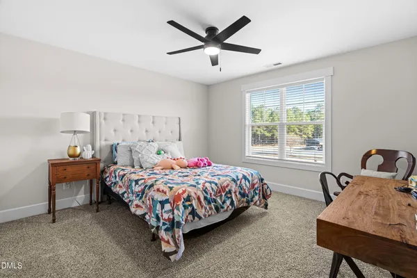 a balcony with furniture and wooden floor