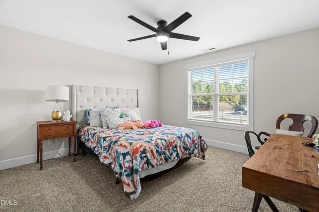 a balcony with furniture and wooden floor