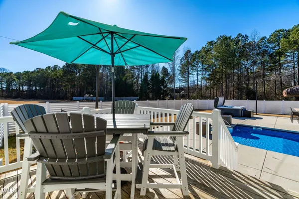 a view of an chairs and table in the patio