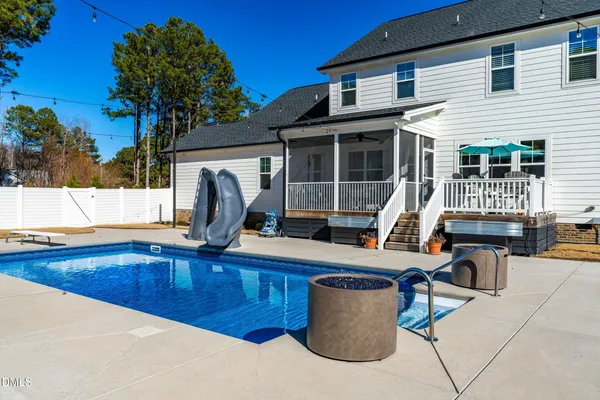 a patio with a table and chairs