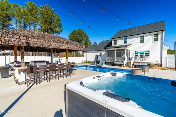 a view of a swimming pool with a patio