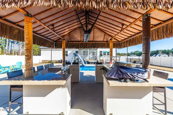 a view of a swimming pool with an outdoor seating