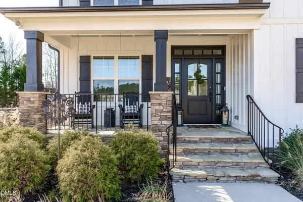 a view of house with outdoor space and swimming pool