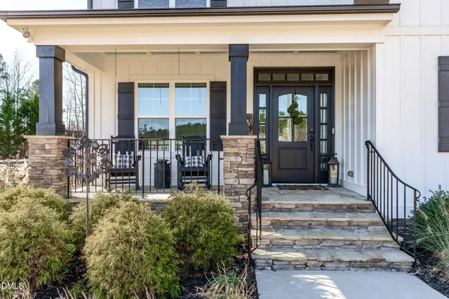 a view of house with outdoor space and swimming pool