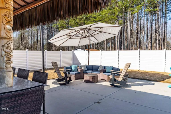 a view of a backyard with sitting area