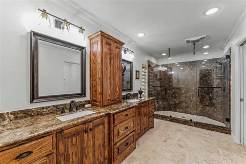 a bathroom with a double vanity sink mirror and double
