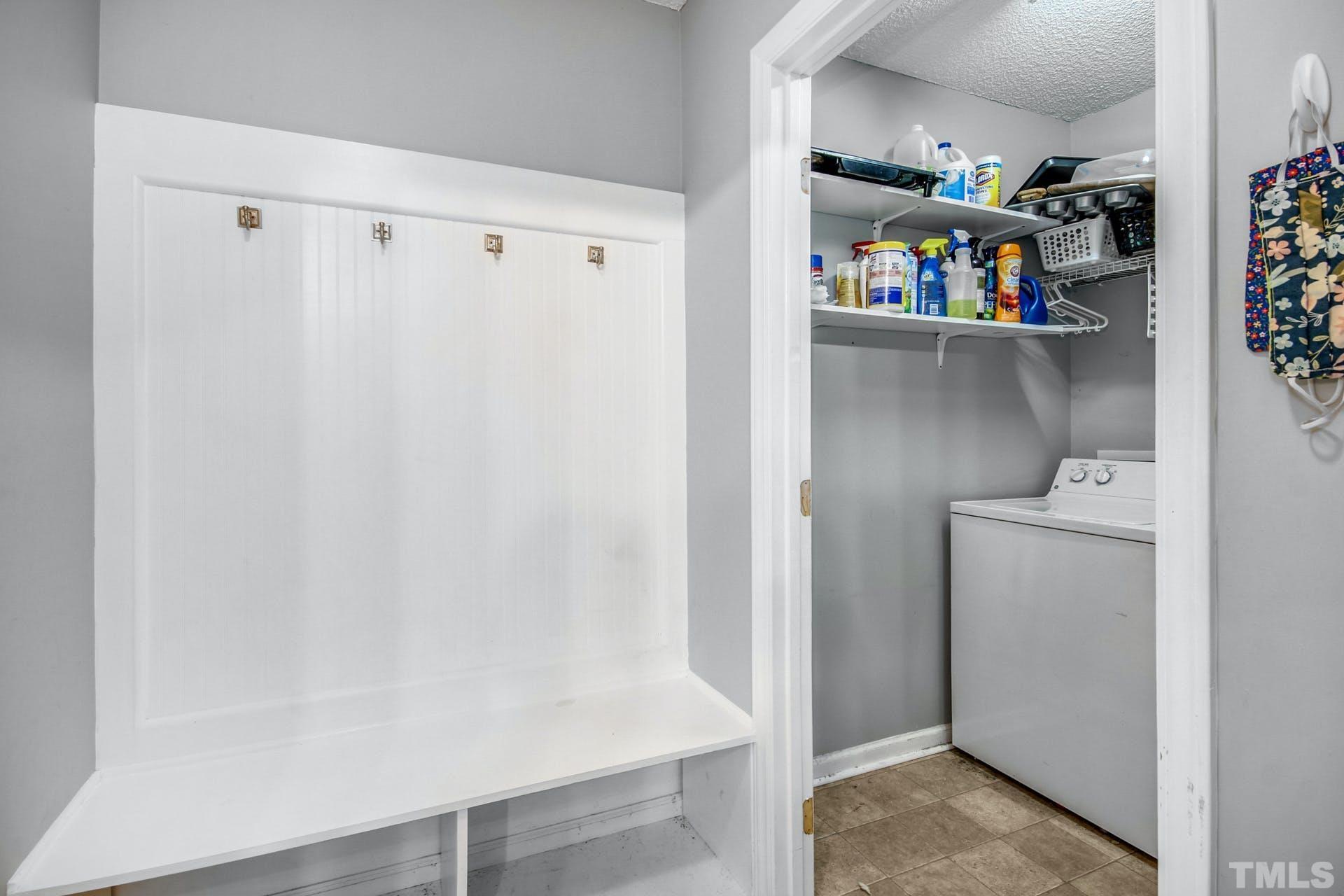 1013 Holland Ridge Drive Raleigh, NC 27603 - Photo 12 of 29 a view of storage and utility room with washer and dryer