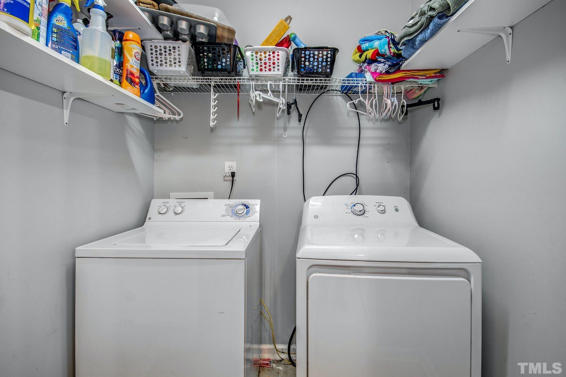 1013 Holland Ridge Drive Raleigh, NC 27603 - Photo 13 of 29 a utility room with dryer and washer