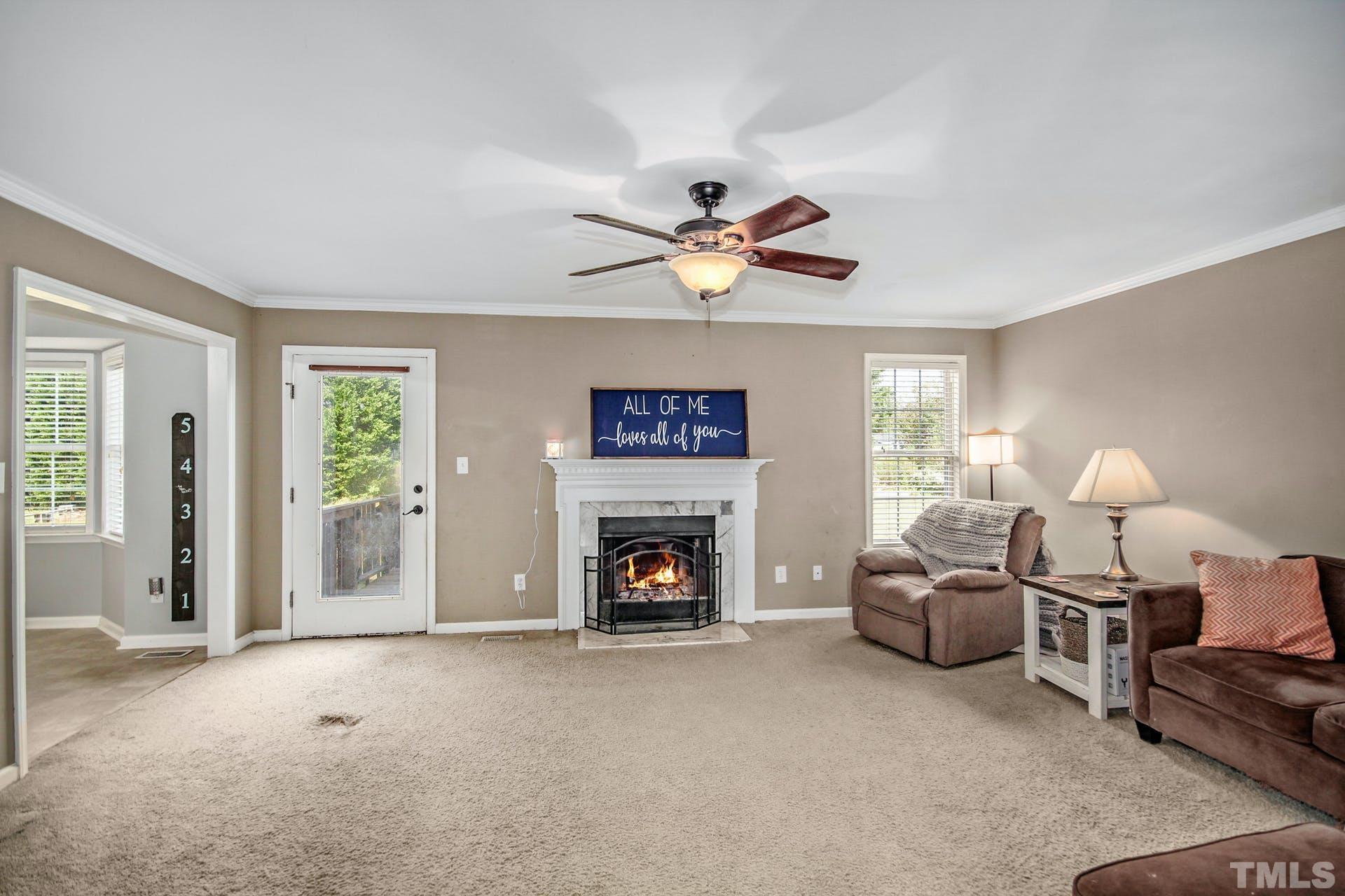 1013 Holland Ridge Drive Raleigh, NC 27603 - Photo 3 of 29 a living room with furniture and a fireplace